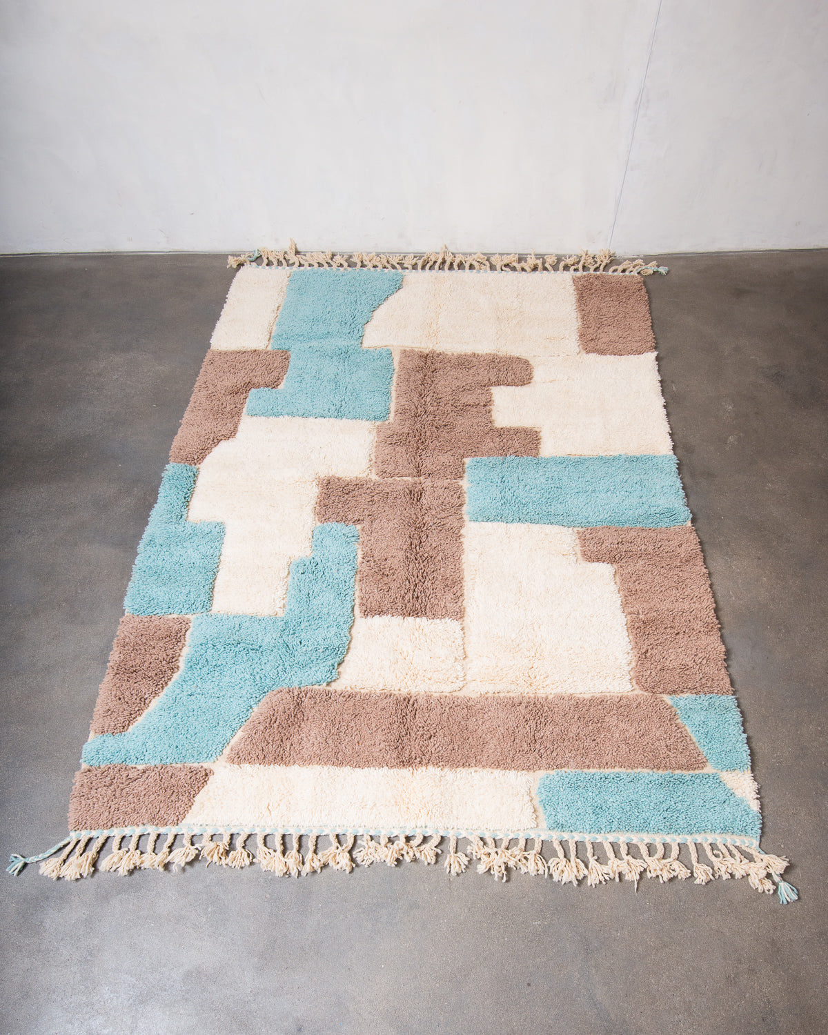 Modern, designer, handcrafted Berber rug from Morocco. Beniourain carpet with beautiful colours and patterns and fluffy wool texture.